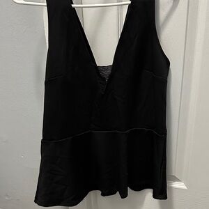 Black peplum going out top